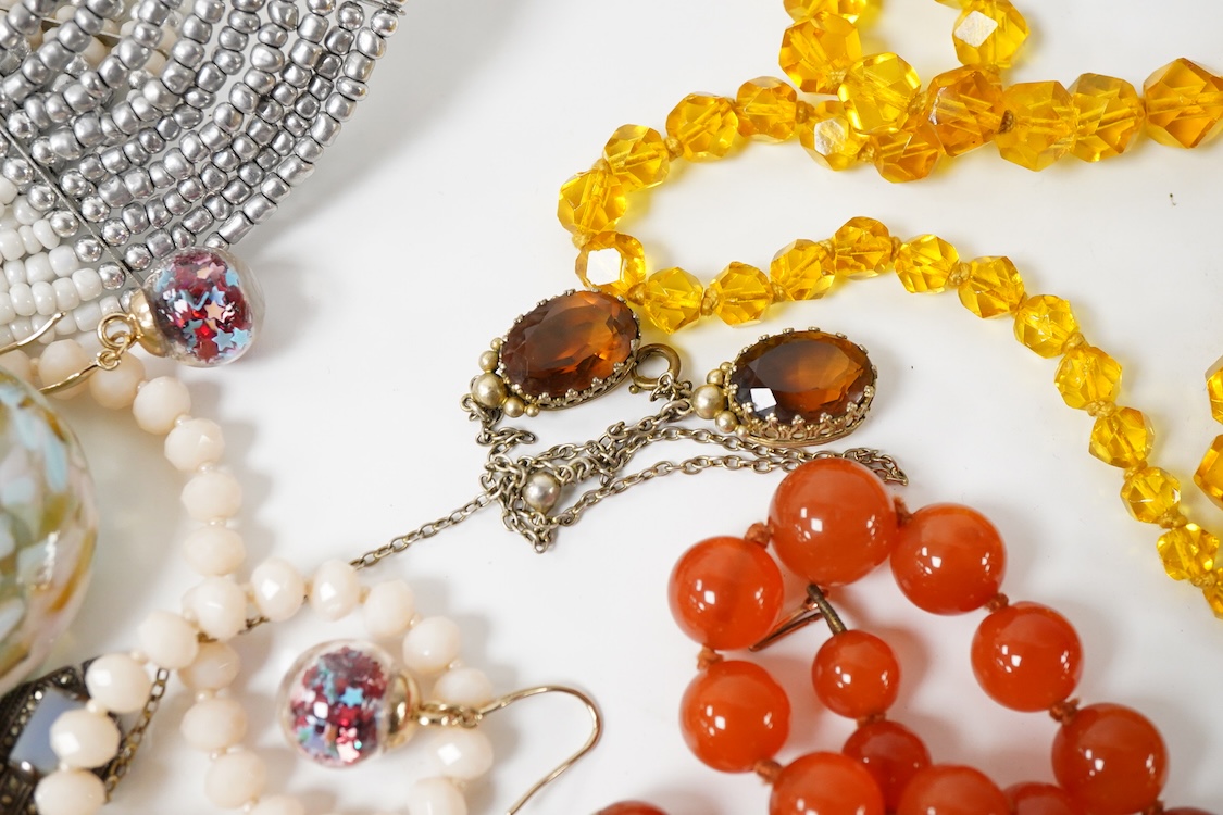 A collection of costume jewellery, including a pair of 9ct gold and garnet cluster set earrings, pair of yellow metal hoop earrings, graduated agate bead necklace, etc.